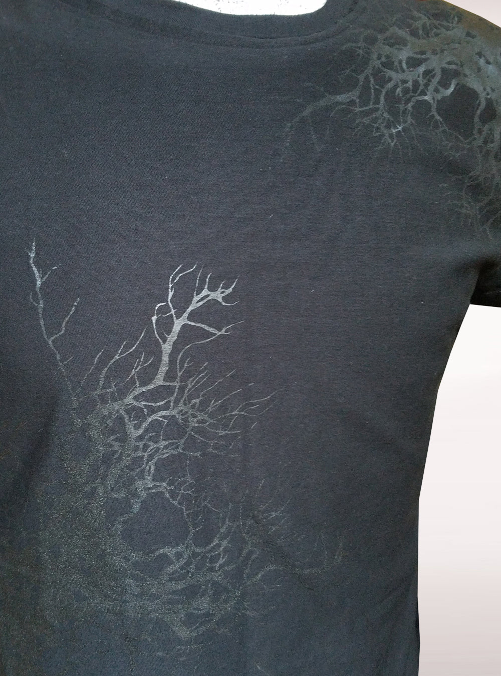 black roots on black t shirt guys